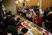 Cause for celebration: Crowds at the buffet after the opening of UniSysCat.